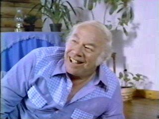 George Kennedy shows his sexiness by unbuttoning the top of his shirt!